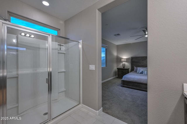 bathroom featuring vanity, ceiling fan, and walk in shower