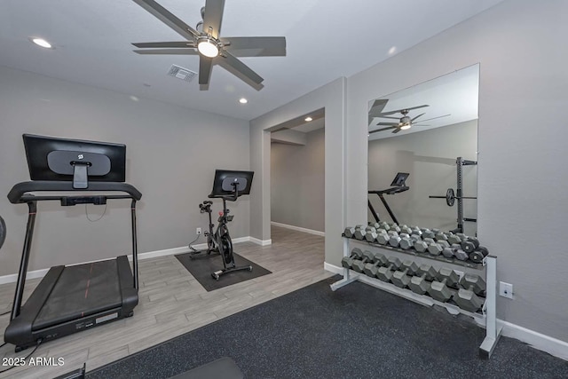 exercise room with ceiling fan and hardwood / wood-style floors