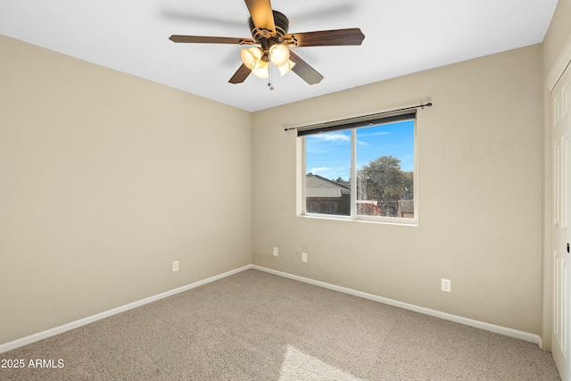 spare room featuring ceiling fan and carpet flooring