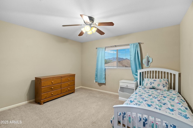 bedroom with ceiling fan and light carpet