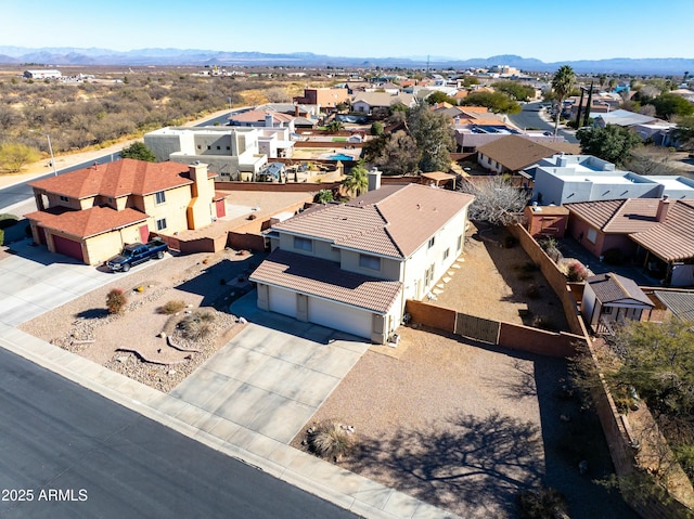 birds eye view of property featuring a mountain view