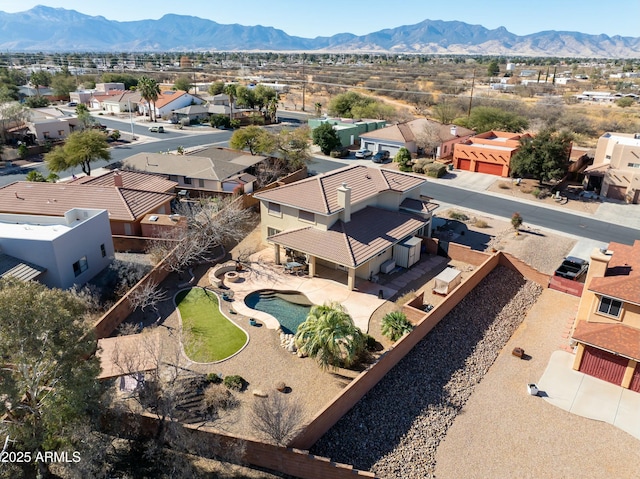 birds eye view of property featuring a mountain view