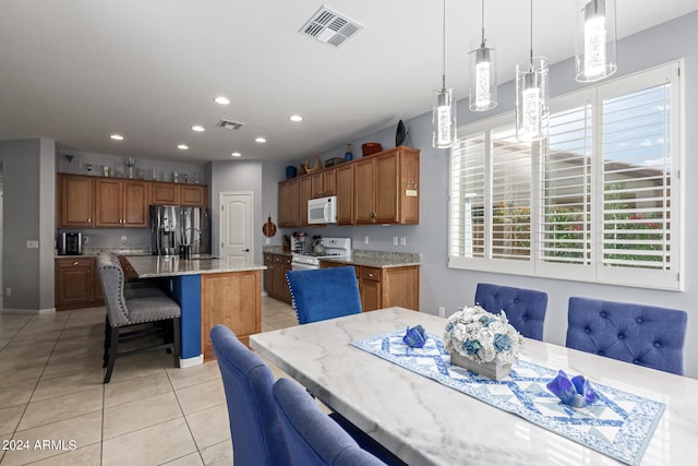 dining space with light tile patterned floors