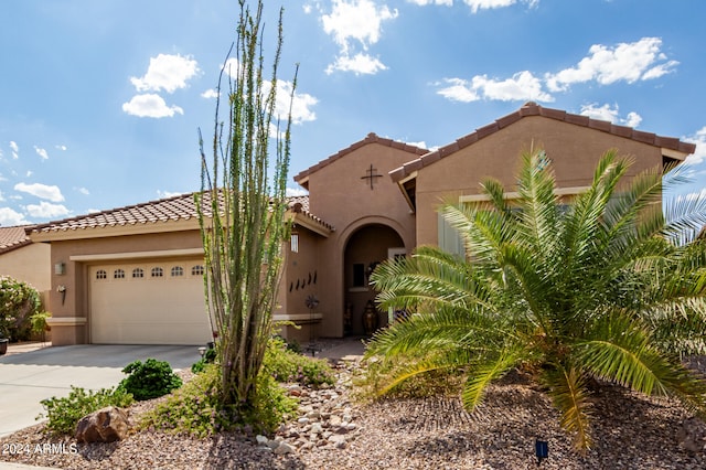 mediterranean / spanish-style house featuring a garage