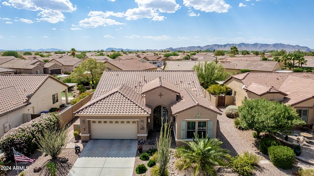 view of front of house featuring a mountain view and a garage