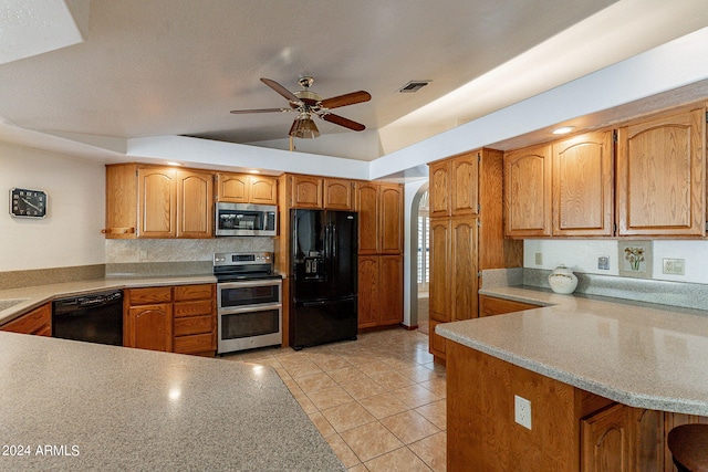 kitchen featuring black appliances, ceiling fan, light tile patterned floors, and kitchen peninsula