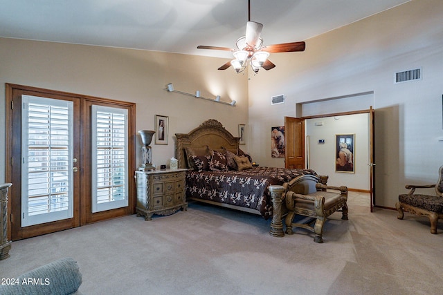 bedroom featuring access to exterior, light colored carpet, and ceiling fan