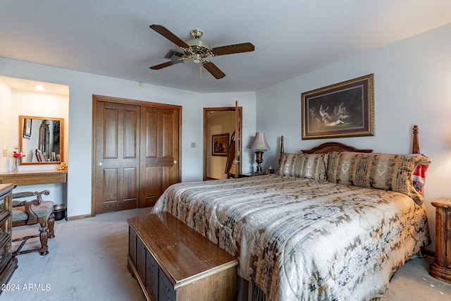 carpeted bedroom with a closet and ceiling fan