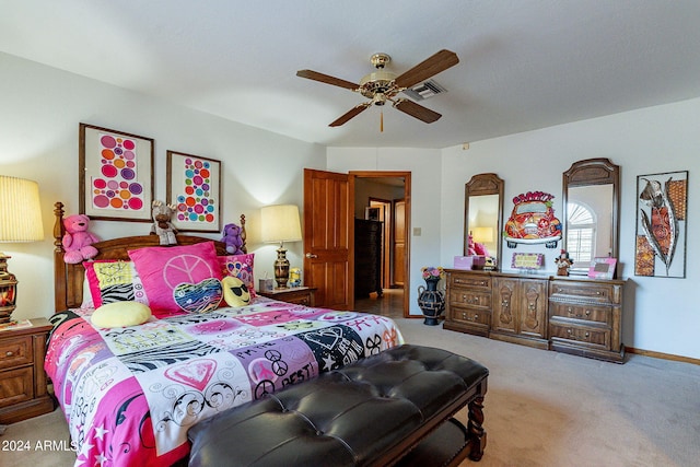 bedroom with ceiling fan and light carpet