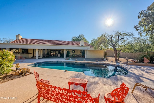 view of pool featuring a patio