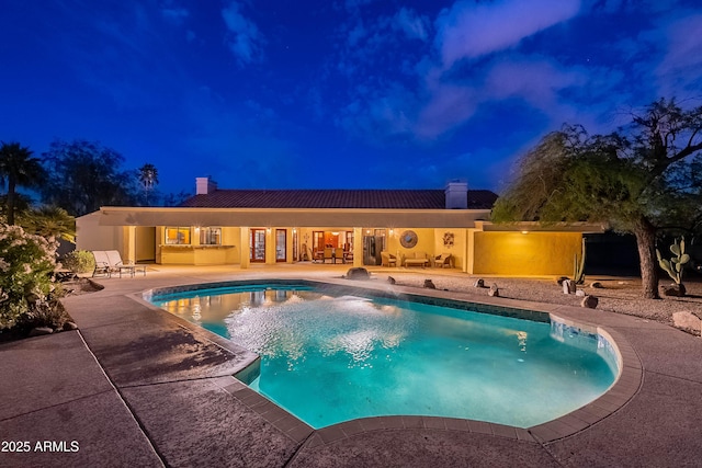 13108 N 76th St, Scottsdale, AZ 85260 - pool at twilight with a patio area and an outdoor pool