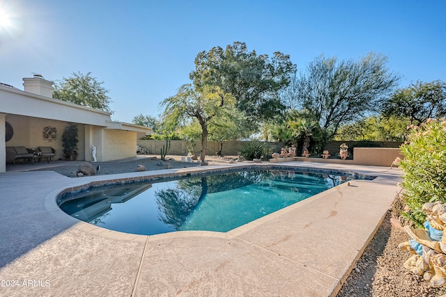 view of swimming pool with a patio