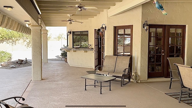 view of patio featuring ceiling fan and french doors