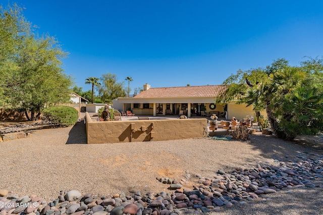 rear view of property with a patio area