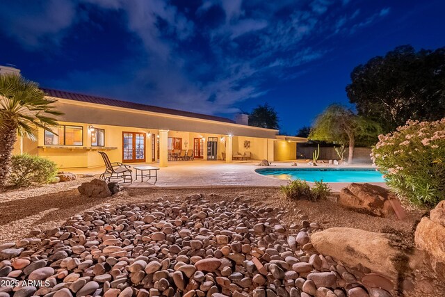 13108 N 76th St, Scottsdale, AZ 85260 - view of exterior entry with stucco siding and a tiled roof