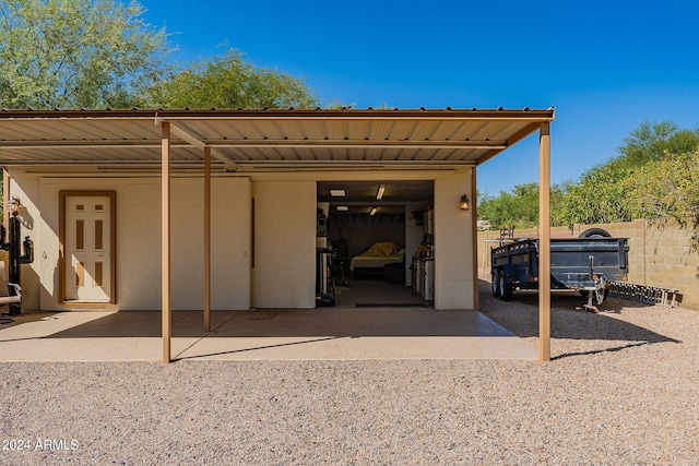 rear view of property with a carport