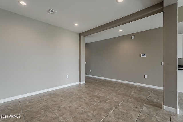 tiled spare room featuring recessed lighting, visible vents, and baseboards
