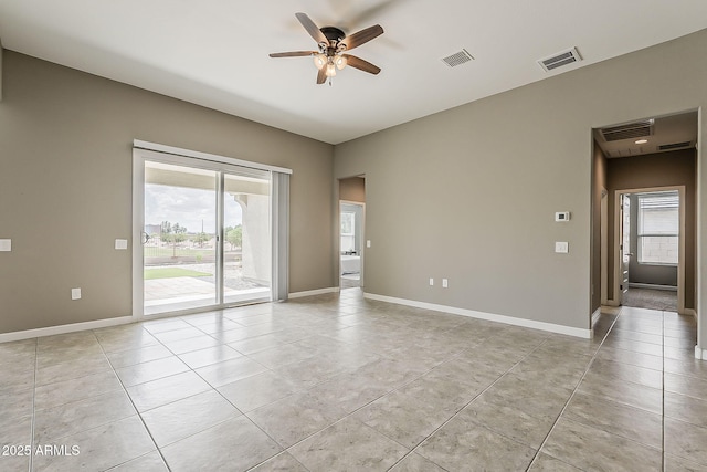 unfurnished room with a ceiling fan, visible vents, and light tile patterned flooring
