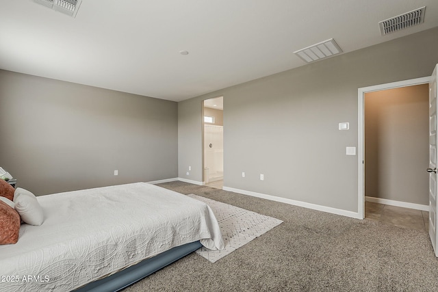 carpeted bedroom featuring baseboards, ensuite bath, and visible vents