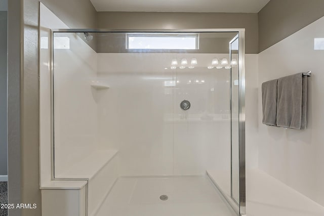 bathroom with a shower stall