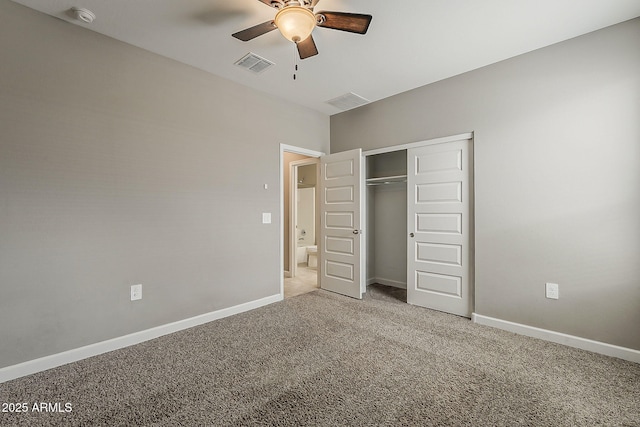 unfurnished bedroom featuring baseboards, a closet, visible vents, and carpet