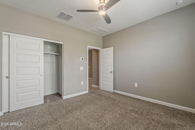 unfurnished bedroom featuring baseboards, a closet, visible vents, and carpet