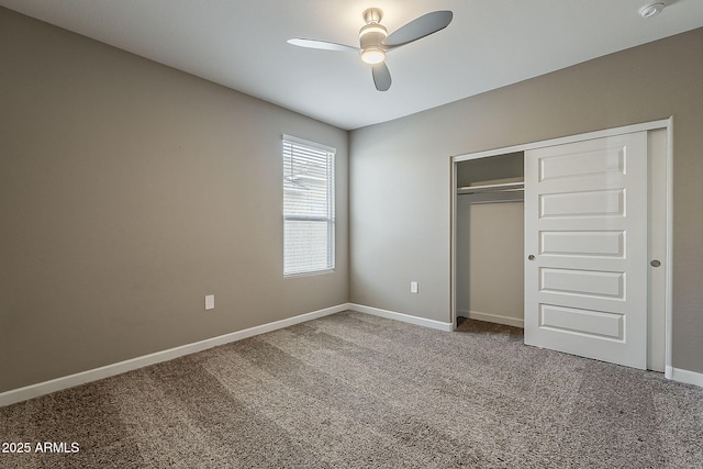 unfurnished bedroom featuring carpet, a closet, baseboards, and ceiling fan
