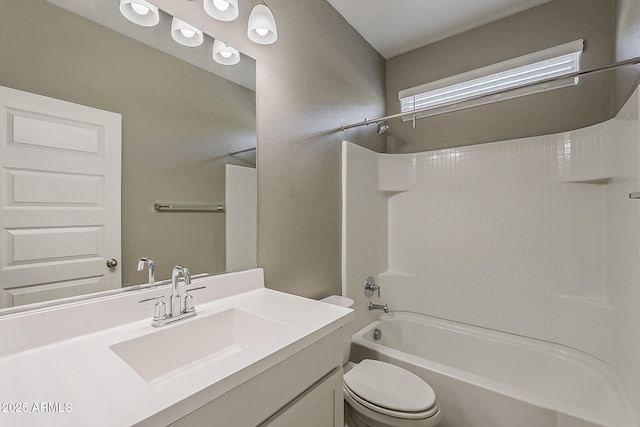 bathroom with toilet, shower / bathtub combination, and vanity