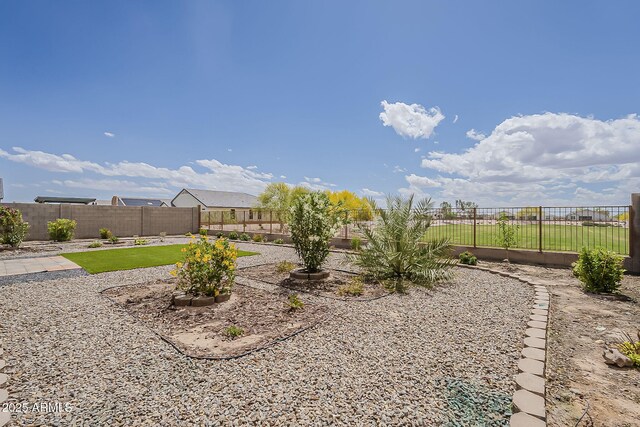 view of yard featuring a patio and a fenced backyard