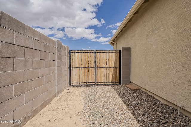 view of gate with fence