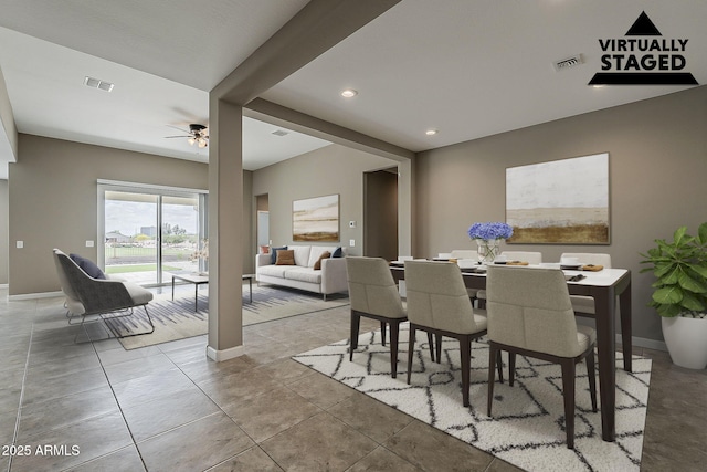 dining room featuring baseboards, a ceiling fan, visible vents, and tile patterned floors