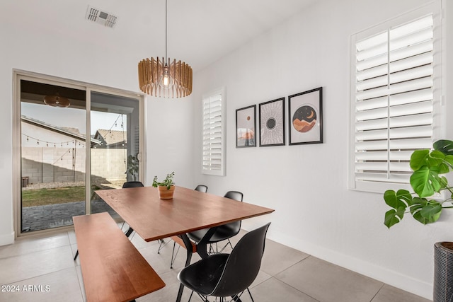 dining space with light tile patterned floors