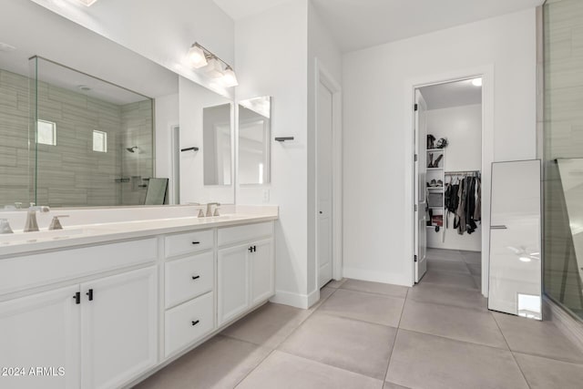 bathroom with vanity, tile patterned floors, and an enclosed shower