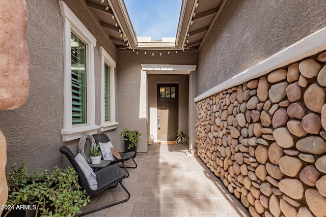 property entrance with a patio