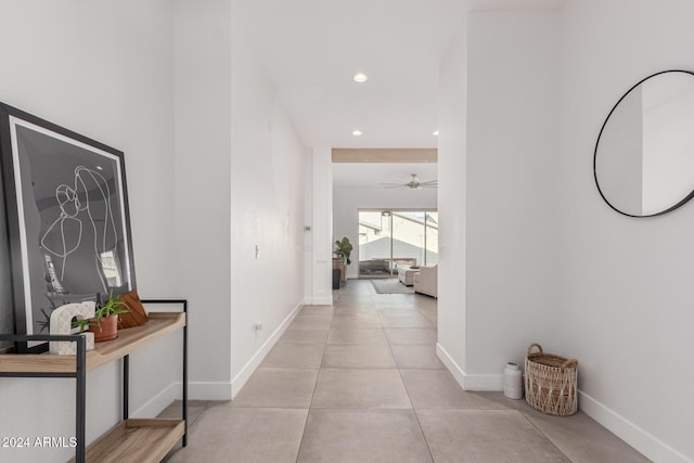 corridor with light tile patterned floors