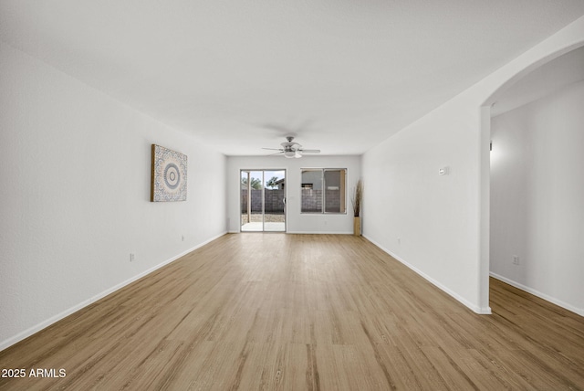 unfurnished living room featuring ceiling fan and light hardwood / wood-style floors