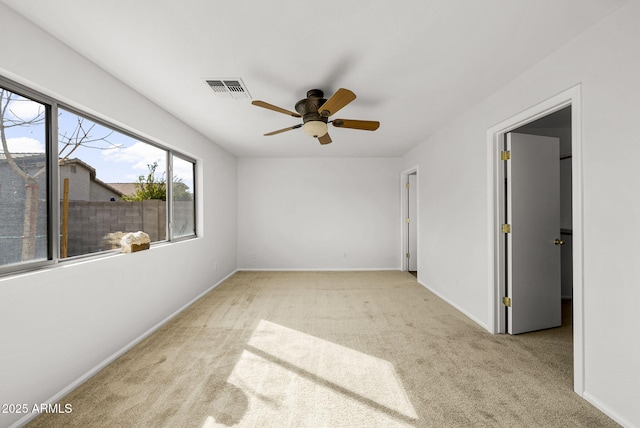 unfurnished bedroom featuring light carpet and ceiling fan