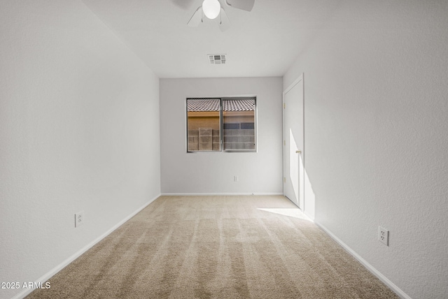 carpeted empty room with ceiling fan