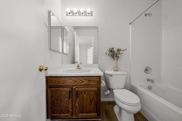 full bathroom with shower / bath combination, vanity, hardwood / wood-style flooring, and toilet