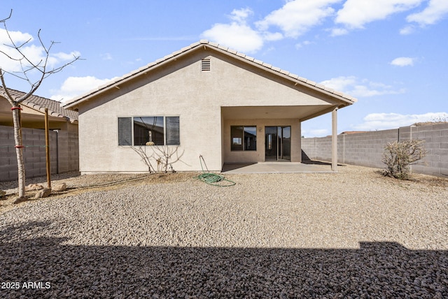 back of property with a patio area