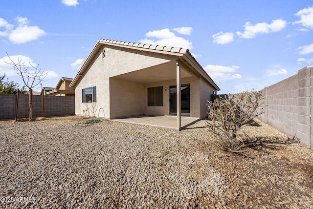 back of property with a patio area