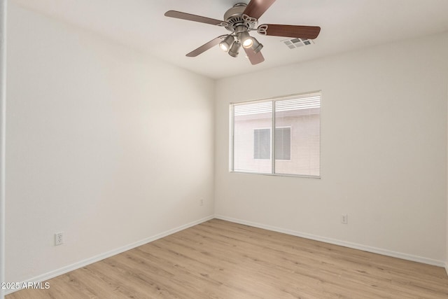 22547 W Pima St, Buckeye, AZ 85326 - spare room featuring light wood-style flooring and a ceiling fan