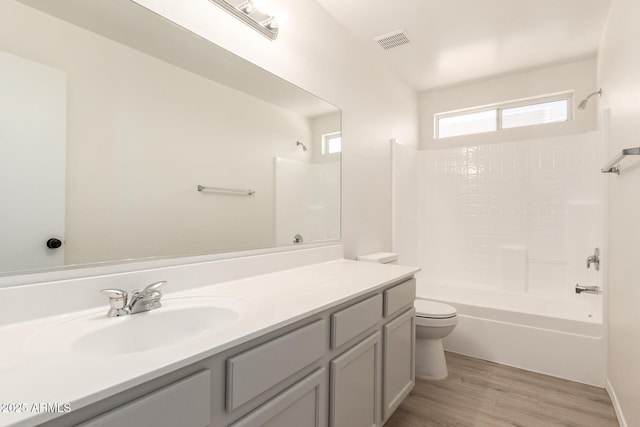 22547 W Pima St, Buckeye, AZ 85326 - full bath featuring bathing tub / shower combination, vanity, and wood finished floors