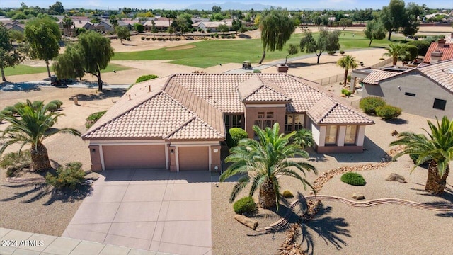 view of front of home featuring a garage and a front lawn