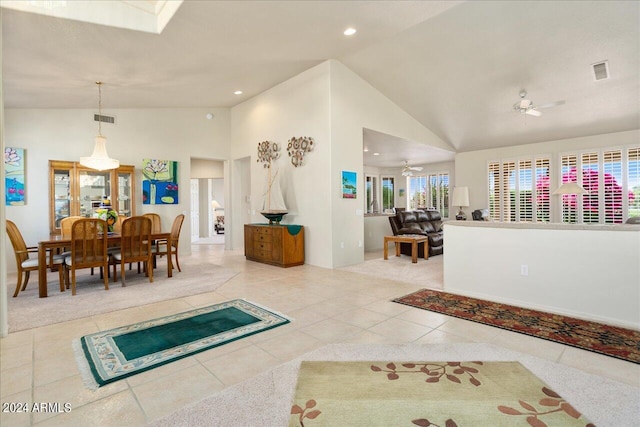 living room with high vaulted ceiling, ceiling fan, and tile floors