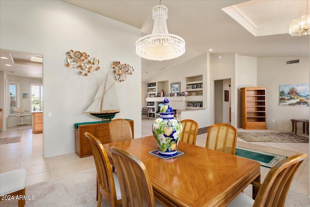 dining space featuring vaulted ceiling, built in features, an inviting chandelier, and light tile floors