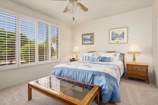 bedroom with ceiling fan and carpet