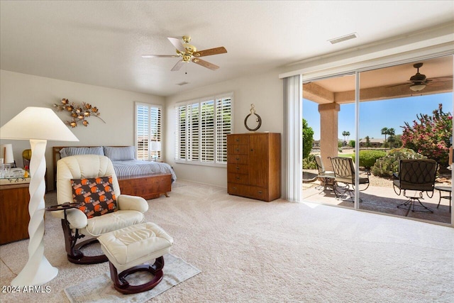 carpeted bedroom featuring ceiling fan and access to outside