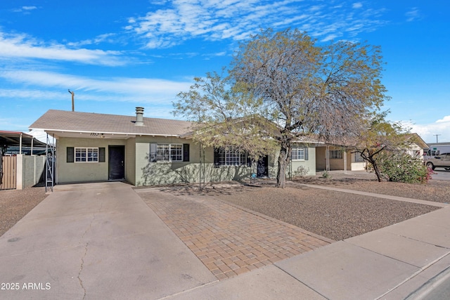 ranch-style home with a carport