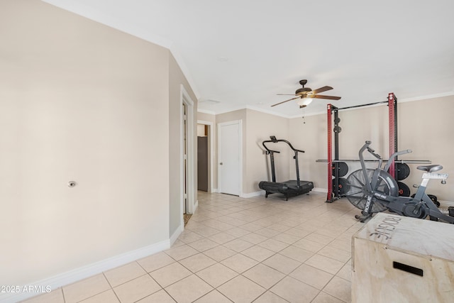 exercise room featuring ceiling fan, crown molding, and light tile patterned floors